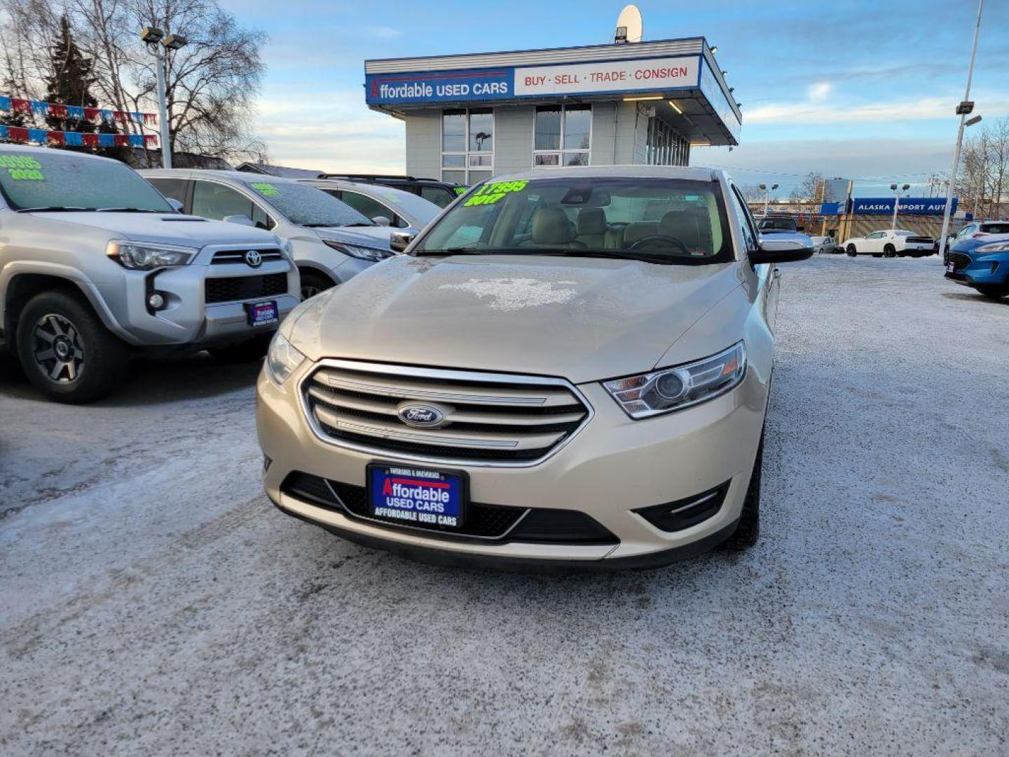 2017 GOLD FORD TAURUS LIMITED (1FAHP2F84HG) with an 3.5L engine, Automatic transmission, located at 929 East 8th Ave, Anchorage, AK, 99501, (907) 274-2277, 61.214783, -149.866074 - Photo#0