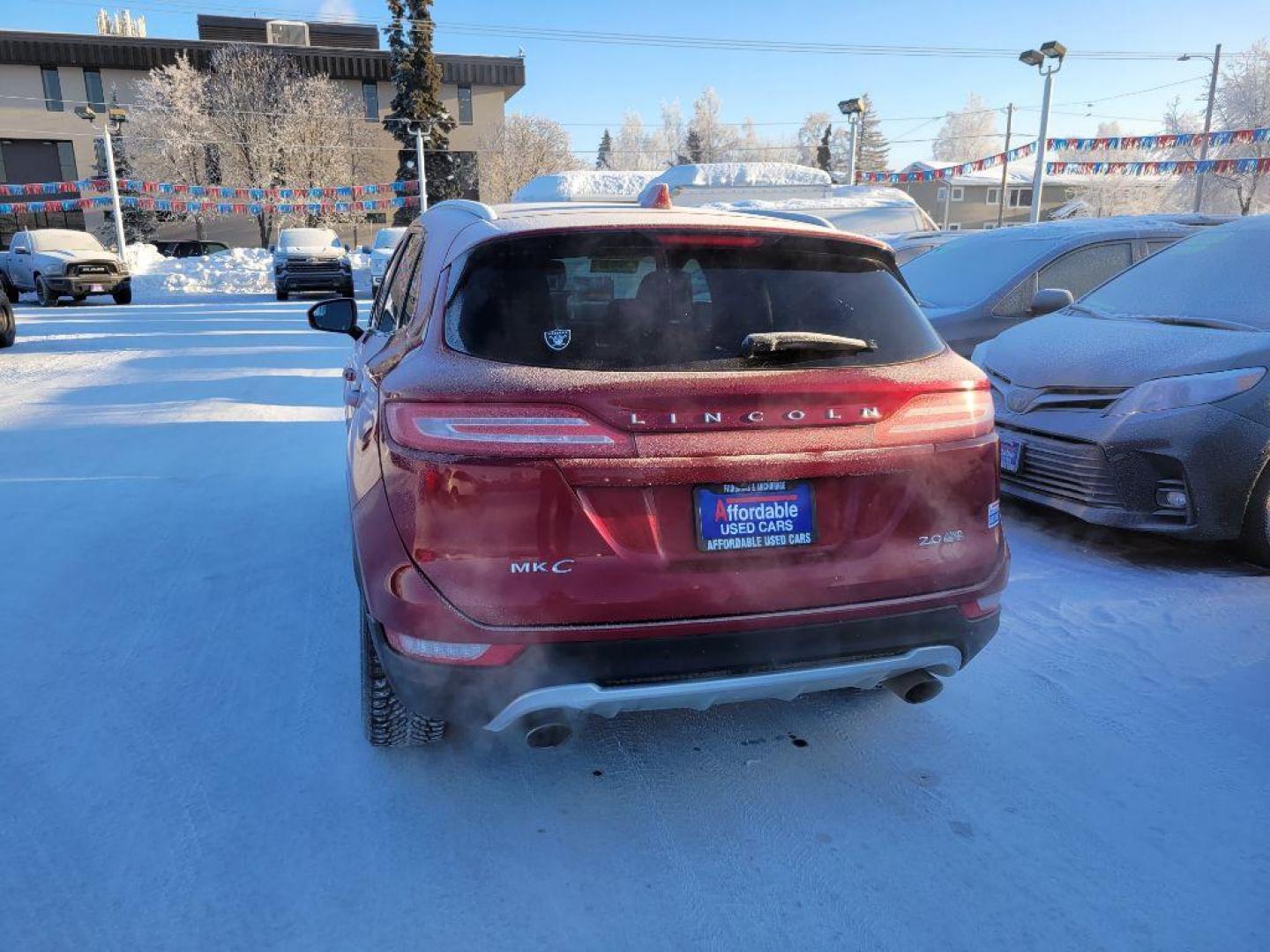 2015 RED LINCOLN MKC (5LMCJ2A95FU) with an 2.0L engine, Automatic transmission, located at 929 East 8th Ave, Anchorage, AK, 99501, (907) 274-2277, 61.214783, -149.866074 - Photo#2