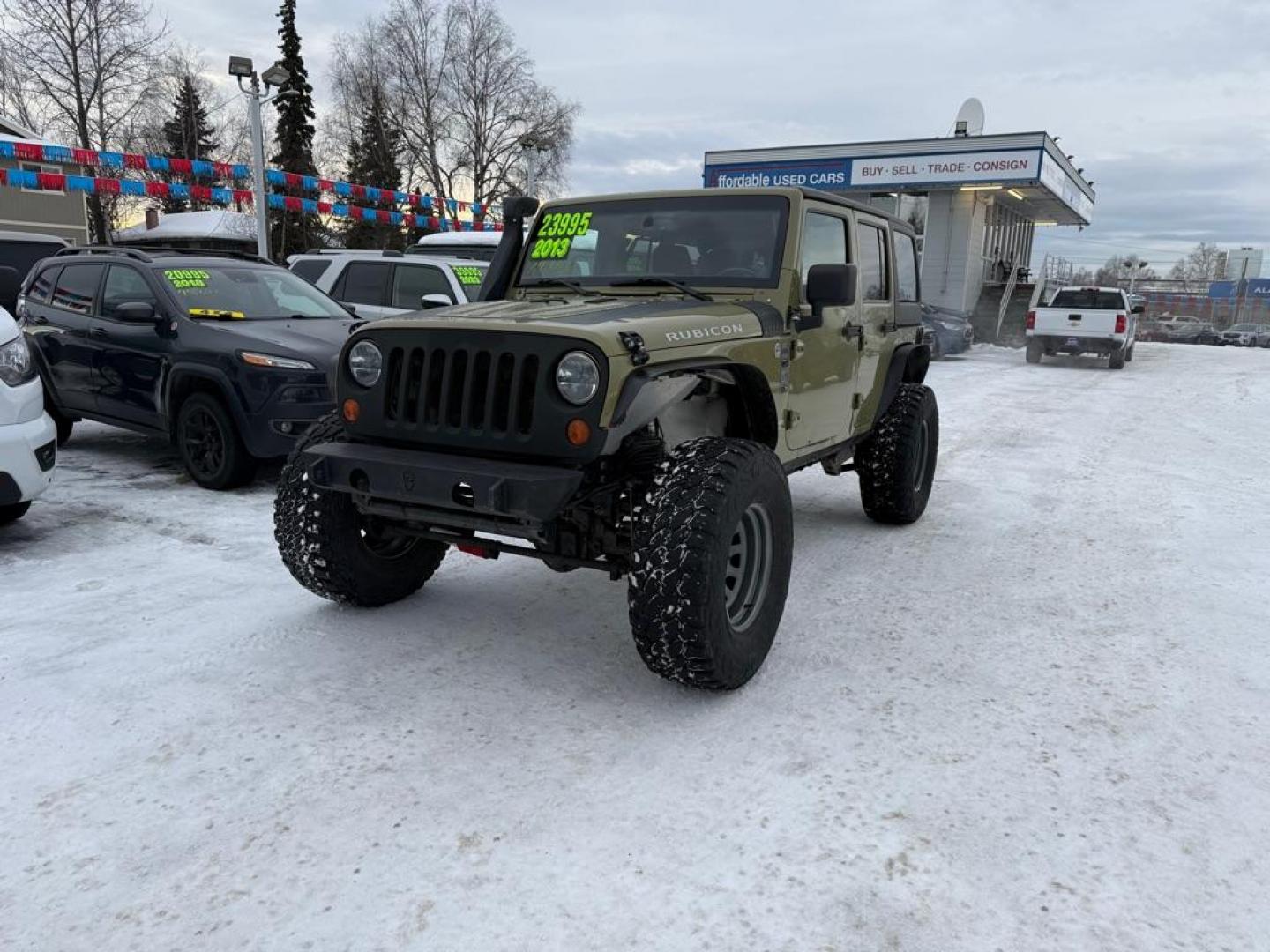 2013 GREEN JEEP WRANGLER UNLIMI RUBICON (1C4BJWFG3DL) with an 3.6L engine, Automatic transmission, located at 929 East 8th Ave, Anchorage, AK, 99501, (907) 274-2277, 61.214783, -149.866074 - Photo#0
