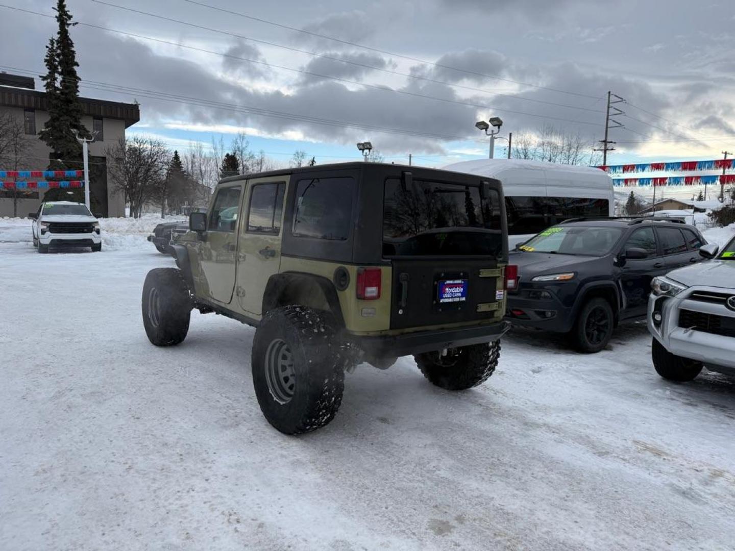 2013 GREEN JEEP WRANGLER UNLIMI RUBICON (1C4BJWFG3DL) with an 3.6L engine, Automatic transmission, located at 929 East 8th Ave, Anchorage, AK, 99501, (907) 274-2277, 61.214783, -149.866074 - Photo#2