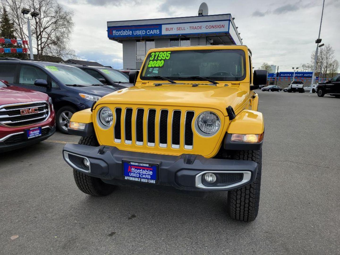 2020 YELLOW JEEP WRANGLER UNLIMI SAHARA (1C4HJXEN2LW) with an 2.0L engine, Automatic transmission, located at 929 East 8th Ave, Anchorage, AK, 99501, (907) 274-2277, 61.214783, -149.866074 - Photo#0