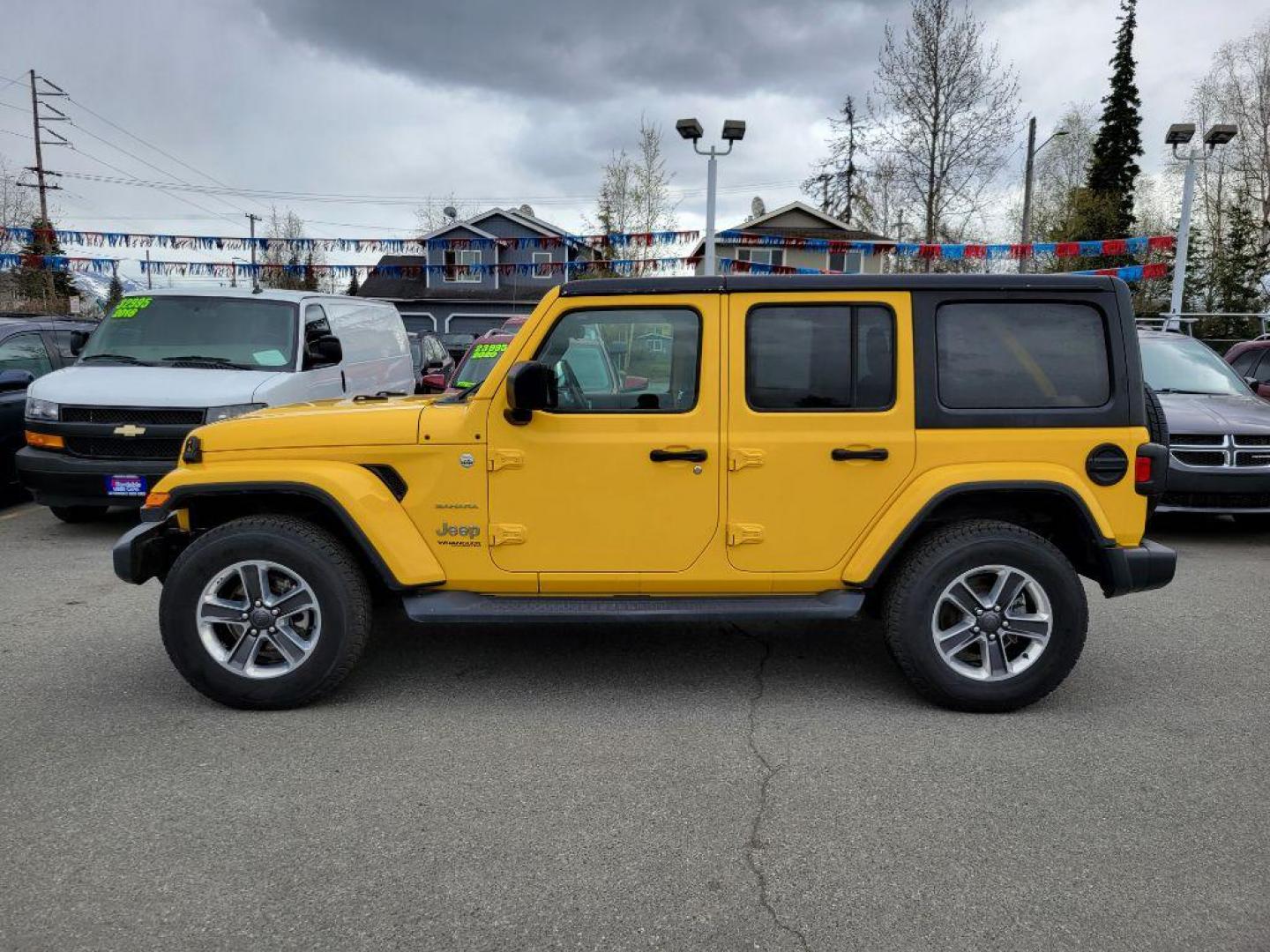 2020 YELLOW JEEP WRANGLER UNLIMI SAHARA (1C4HJXEN2LW) with an 2.0L engine, Automatic transmission, located at 929 East 8th Ave, Anchorage, AK, 99501, (907) 274-2277, 61.214783, -149.866074 - Photo#1