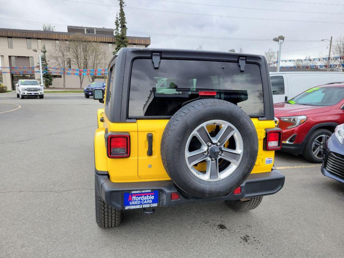 2020 YELLOW JEEP WRANGLER UNLIMI SAHARA (1C4HJXEN2LW) with an 2.0L engine, Automatic transmission, located at 929 East 8th Ave, Anchorage, AK, 99501, (907) 274-2277, 61.214783, -149.866074 - Photo#2