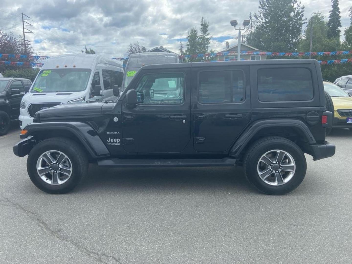 2020 BLACK JEEP WRANGLER UNLIMI SAHARA (1C4HJXEN8LW) with an 2.0L engine, Automatic transmission, located at 929 East 8th Ave, Anchorage, AK, 99501, (907) 274-2277, 61.214783, -149.866074 - Photo#1