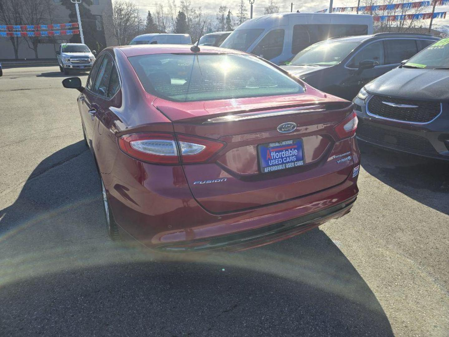 2015 RED FORD FUSION TITANIUM HEV (3FA6P0RU9FR) with an 2.0L engine, Continuously Variable transmission, located at 929 East 8th Ave, Anchorage, AK, 99501, (907) 274-2277, 61.214783, -149.866074 - Photo#2
