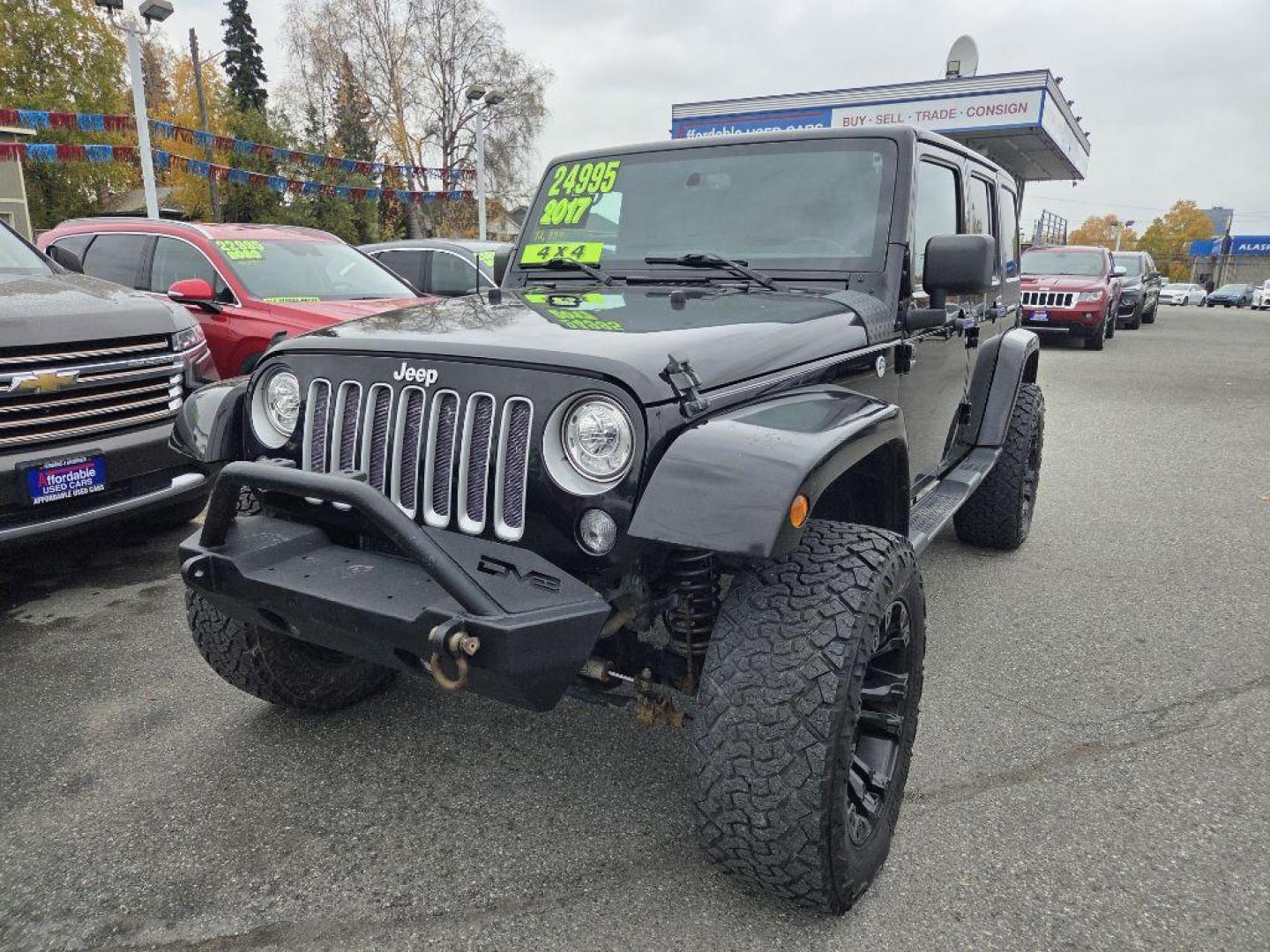 2017 BLACK JEEP WRANGLER UNLIMI SAHARA (1C4HJWEG4HL) with an 3.6L engine, Automatic transmission, located at 929 East 8th Ave, Anchorage, AK, 99501, (907) 274-2277, 61.214783, -149.866074 - Photo#0
