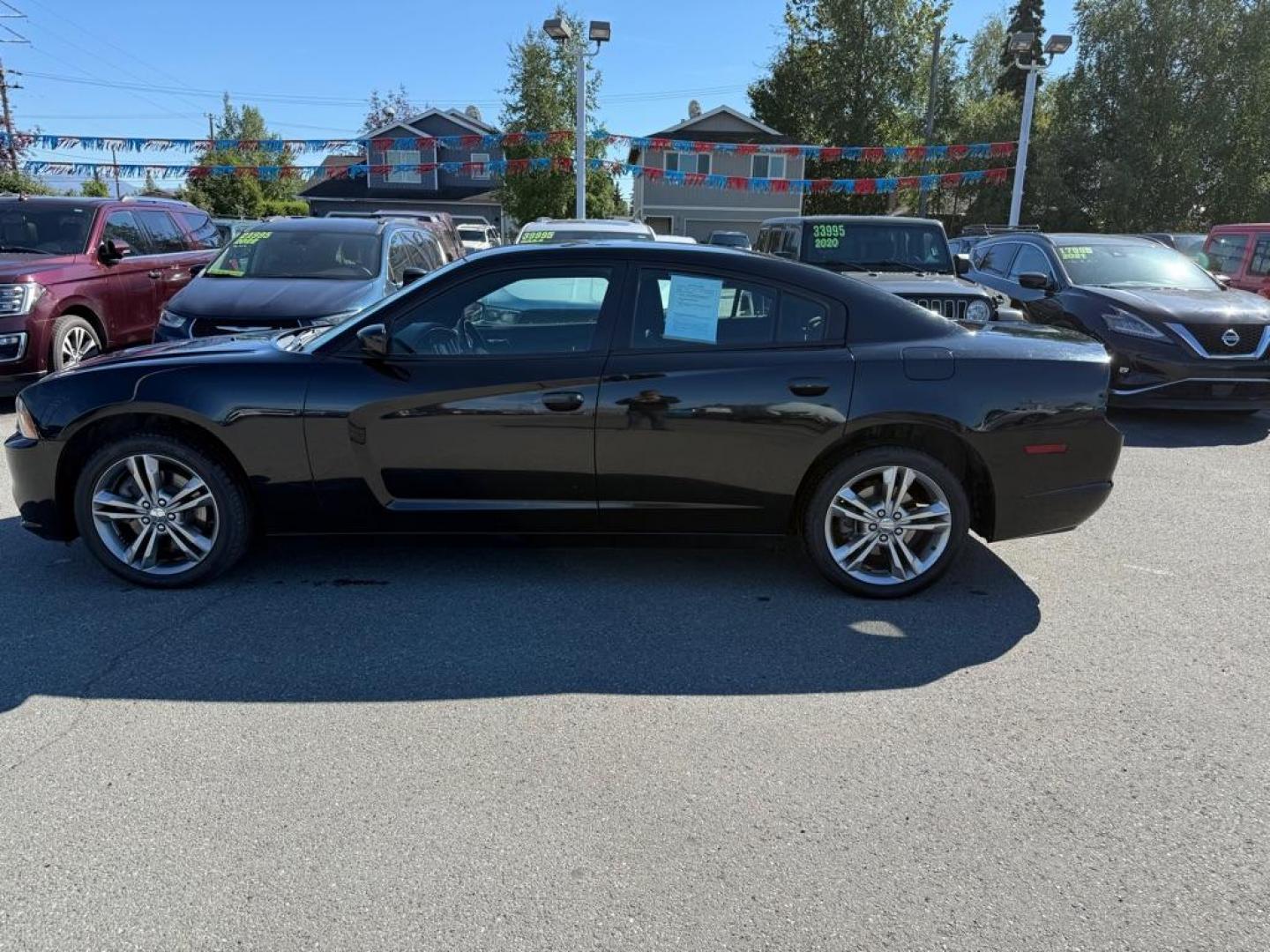 2014 BLACK DODGE CHARGER SE (2C3CDXFG0EH) with an 3.6L engine, Automatic transmission, located at 929 East 8th Ave, Anchorage, AK, 99501, (907) 274-2277, 61.214783, -149.866074 - Photo#1
