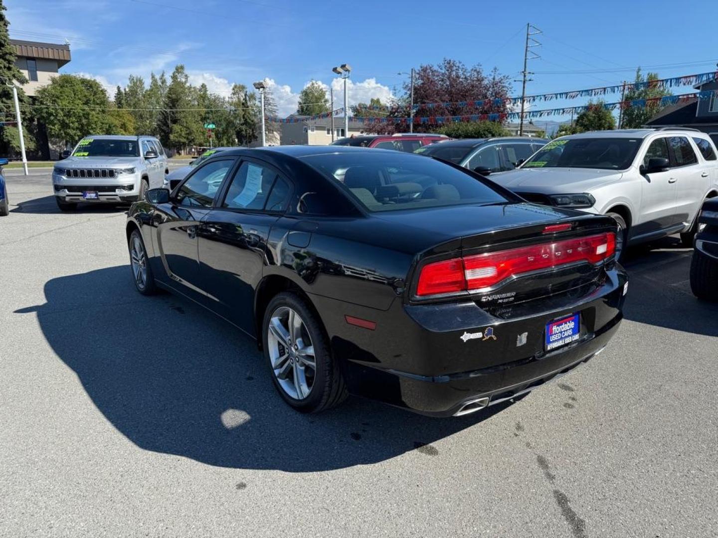 2014 BLACK DODGE CHARGER SE (2C3CDXFG0EH) with an 3.6L engine, Automatic transmission, located at 929 East 8th Ave, Anchorage, AK, 99501, (907) 274-2277, 61.214783, -149.866074 - Photo#2