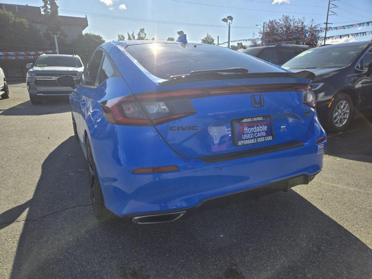 2022 BLUE HONDA CIVIC SPORT TOURING (19XFL1H86NE) with an 1.5L engine, Continuously Variable transmission, located at 929 East 8th Ave, Anchorage, AK, 99501, (907) 274-2277, 61.214783, -149.866074 - Photo#2