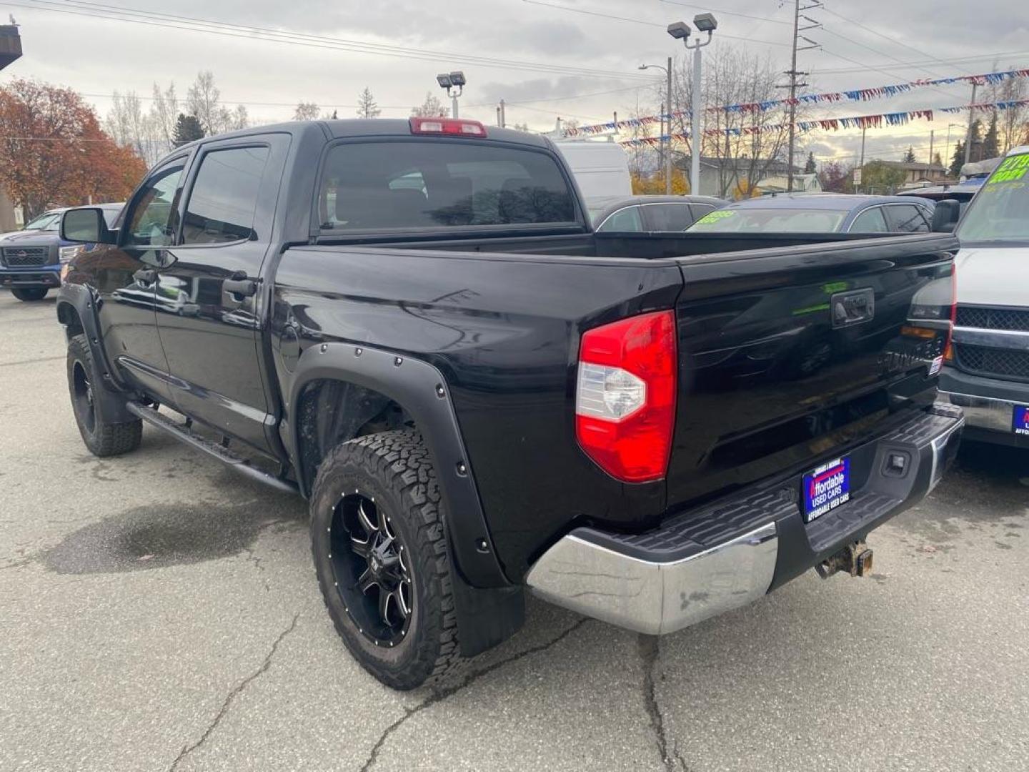2017 BLACK TOYOTA TUNDRA CREWMAX SR5 (5TFDY5F1XHX) with an 5.7L engine, Automatic transmission, located at 929 East 8th Ave, Anchorage, AK, 99501, (907) 274-2277, 61.214783, -149.866074 - Photo#2