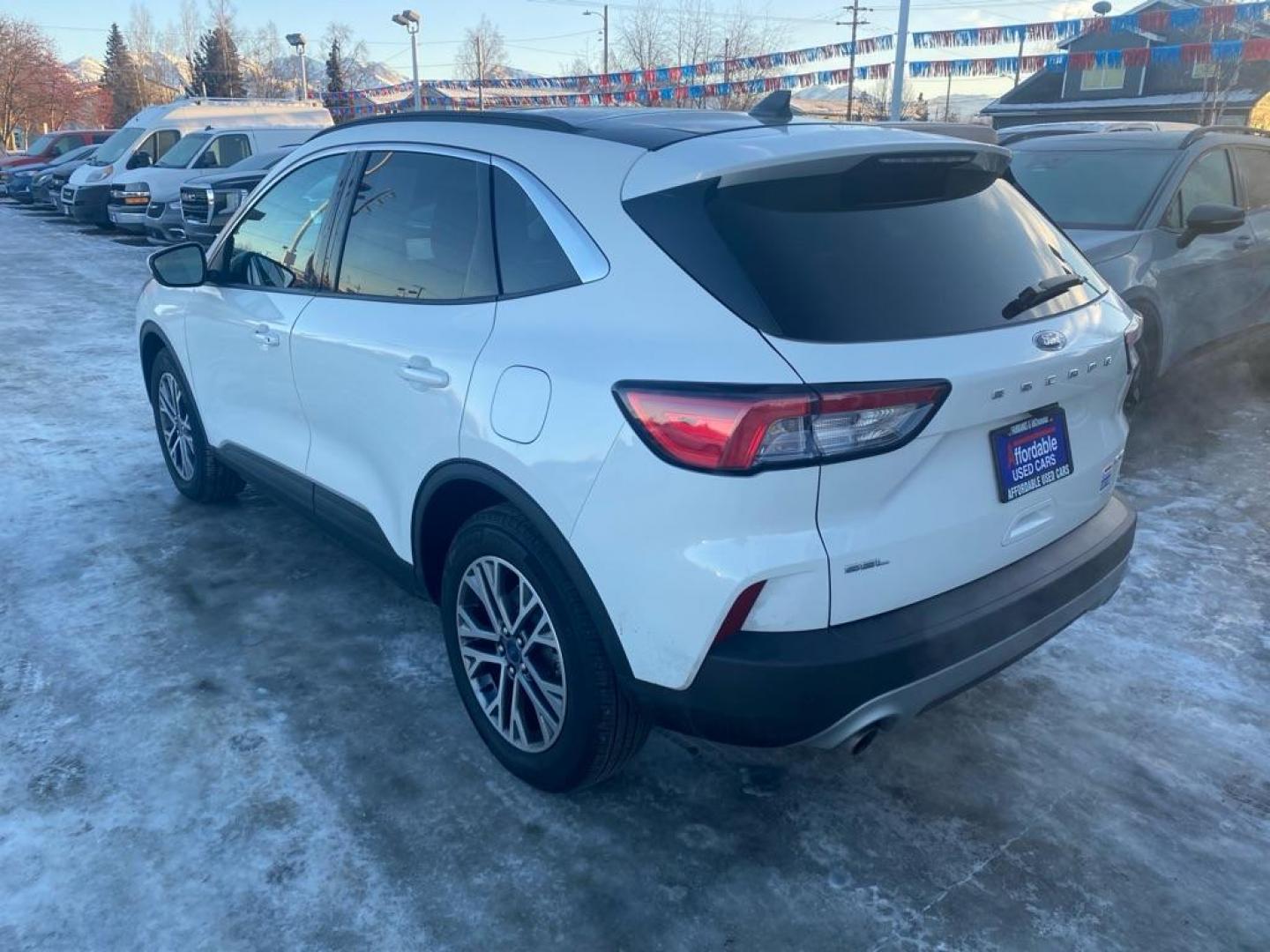 2021 WHITE FORD ESCAPE SEL (1FMCU9H66MU) with an 1.5L engine, Automatic transmission, located at 929 East 8th Ave, Anchorage, AK, 99501, (907) 274-2277, 61.214783, -149.866074 - Photo#2
