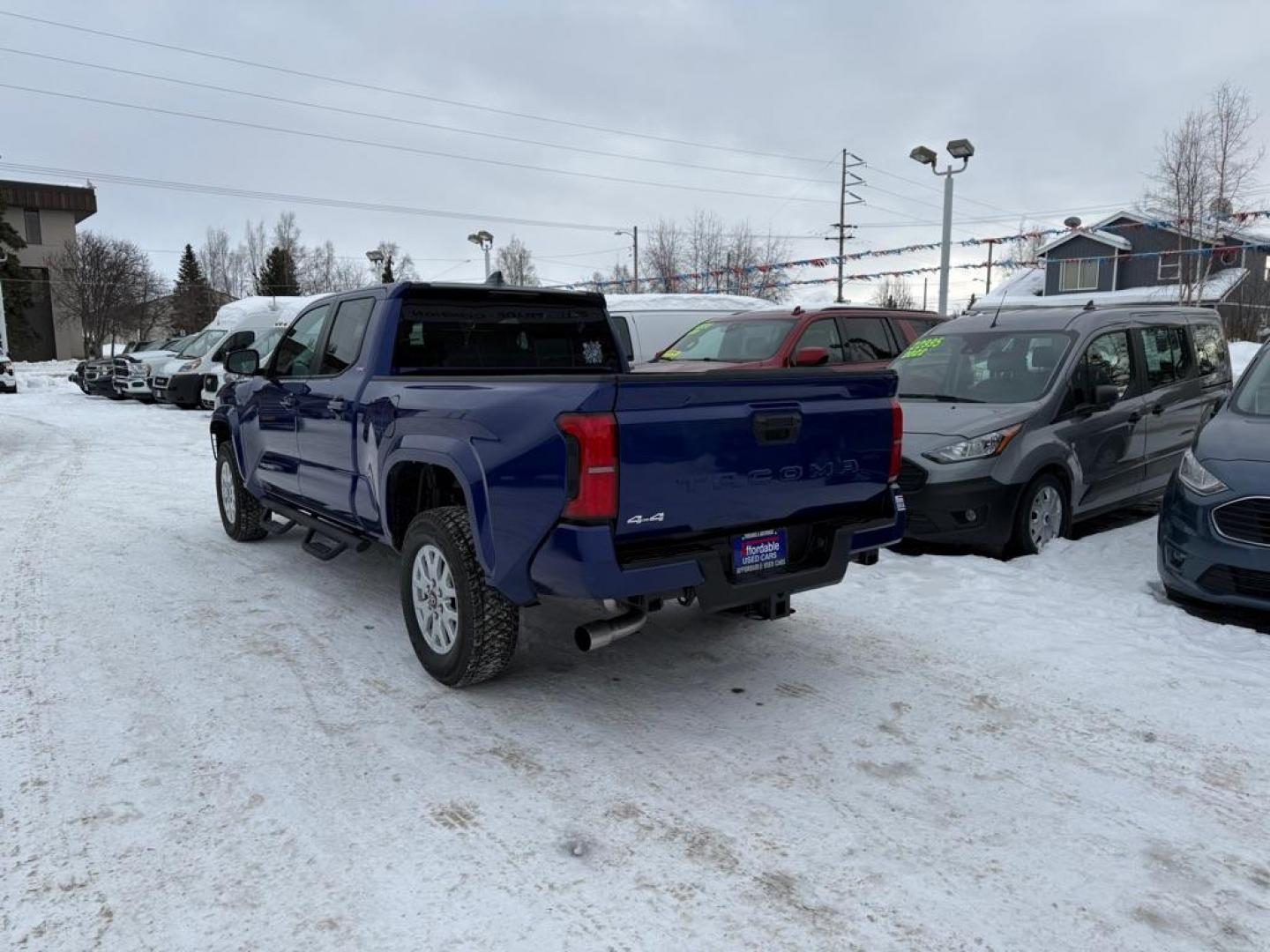 2025 BLUE TOYOTA TACOMA DOUBLE CAB LB (3TMLB5JN1SM) with an 2.4L engine, Automatic transmission, located at 929 East 8th Ave, Anchorage, AK, 99501, (907) 274-2277, 61.214783, -149.866074 - Photo#2
