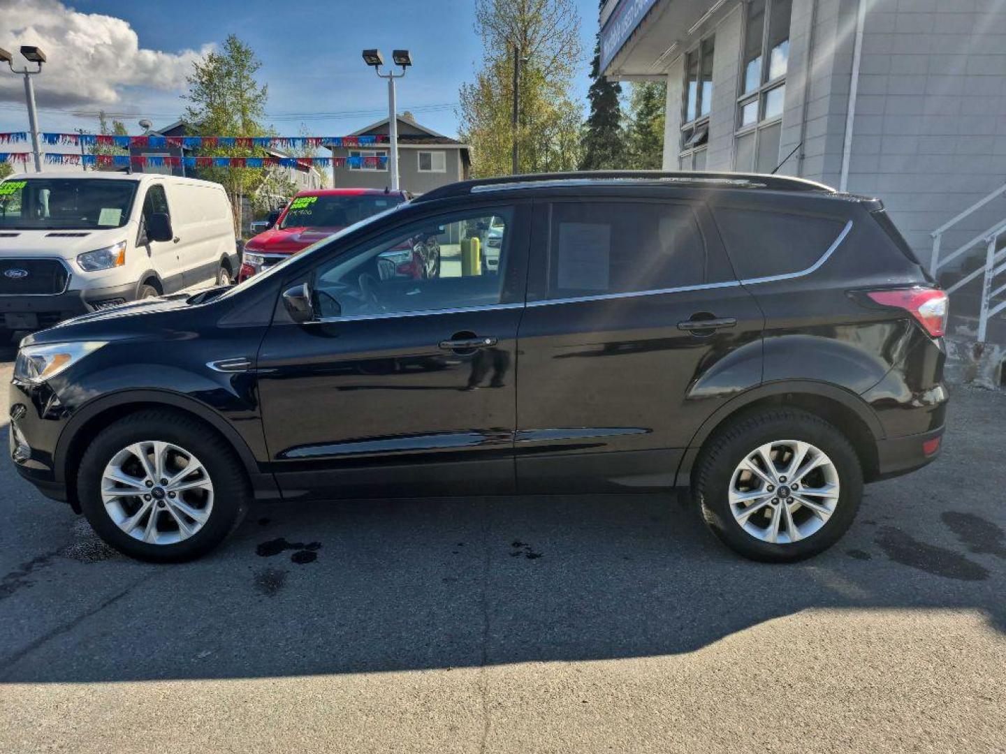 2018 BLACK FORD ESCAPE SE SE (1FMCU9GDXJU) with an 1.5L engine, Automatic transmission, located at 929 East 8th Ave, Anchorage, AK, 99501, (907) 274-2277, 61.214783, -149.866074 - Photo#1