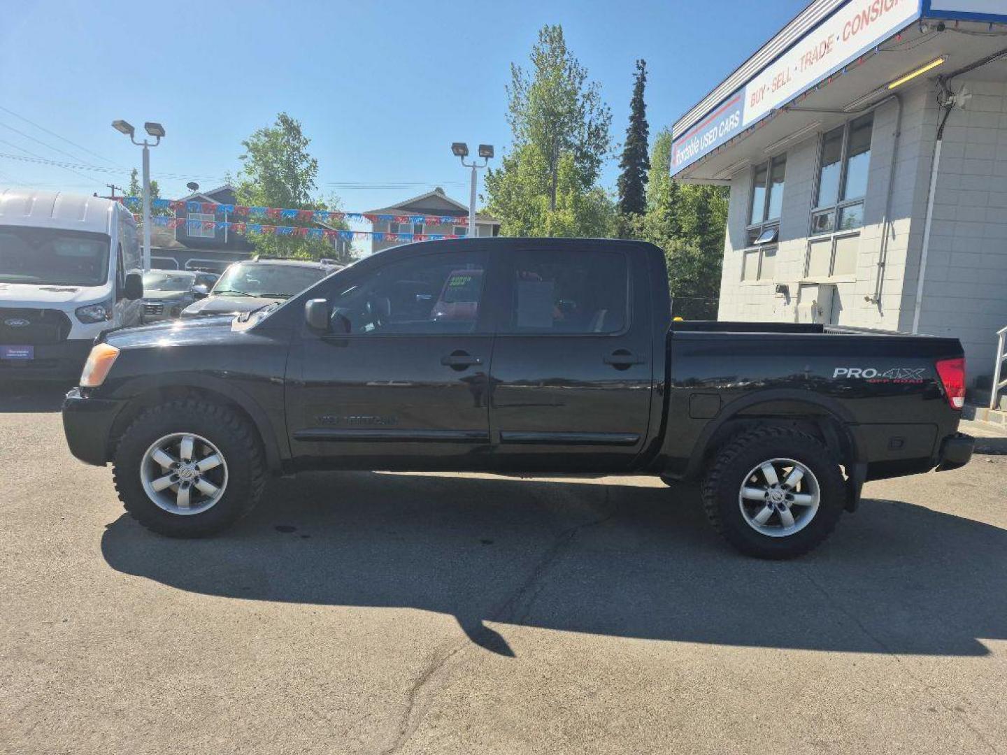 2012 BLACK NISSAN TITAN S (1N6BA0EC9CN) with an 5.6L engine, Automatic transmission, located at 929 East 8th Ave, Anchorage, AK, 99501, (907) 274-2277, 61.214783, -149.866074 - Photo#1