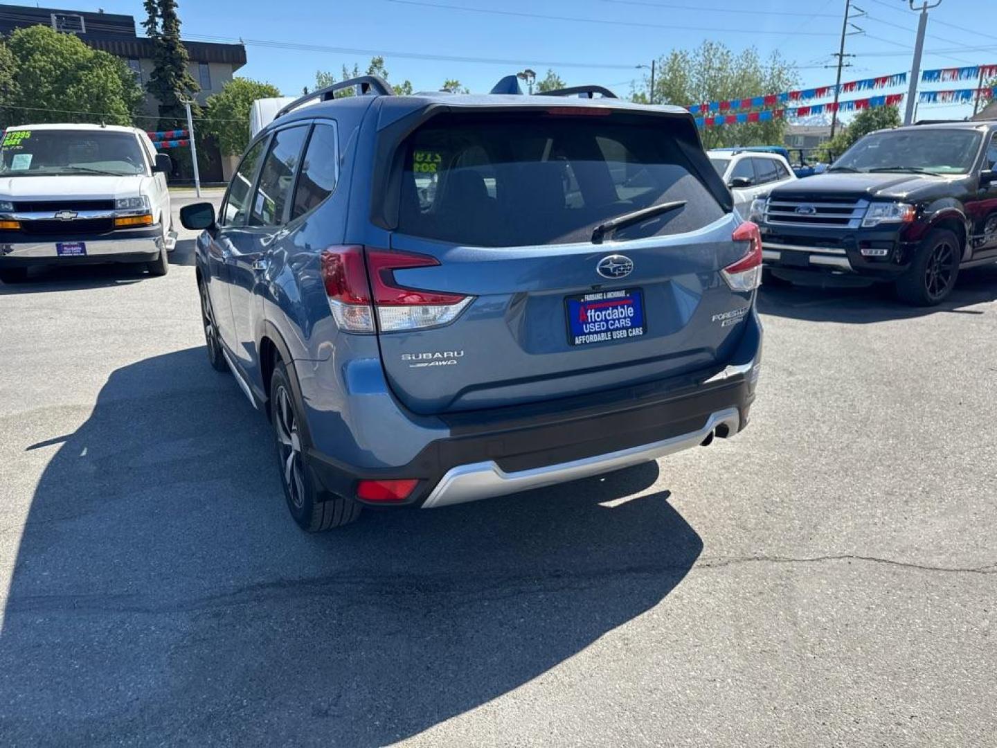 2019 BLUE SUBARU FORESTER TOURING (JF2SKAWC0KH) with an 2.5L engine, Continuously Variable transmission, located at 929 East 8th Ave, Anchorage, AK, 99501, (907) 274-2277, 61.214783, -149.866074 - Photo#4