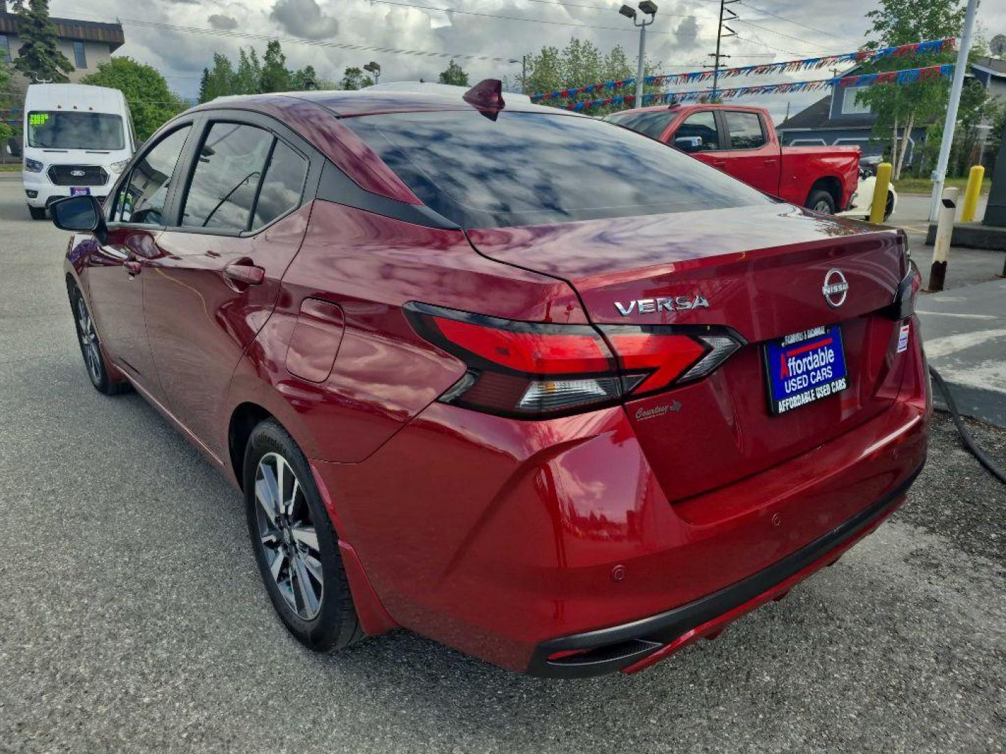 2024 MAROON NISSAN VERSA SV (3N1CN8EV6RL) with an 1.6L engine, Continuously Variable transmission, located at 929 East 8th Ave, Anchorage, AK, 99501, (907) 274-2277, 61.214783, -149.866074 - Photo#2